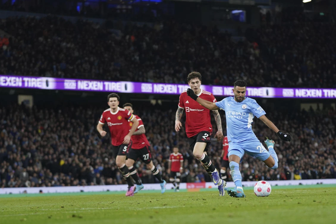Man City’s Riyad Mahrez scores his side’s fourth goal during the English Premier League game against Man United, Etihad Stadium, Manchester, England, Sunday, Mar. 6, 2022. (AP Photo)