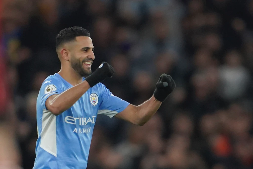 Manchester City's Riyad Mahrez celebrates after scoring his side's fourth goal during the English Premier League soccer match between Manchester City and Manchester United. (AP)