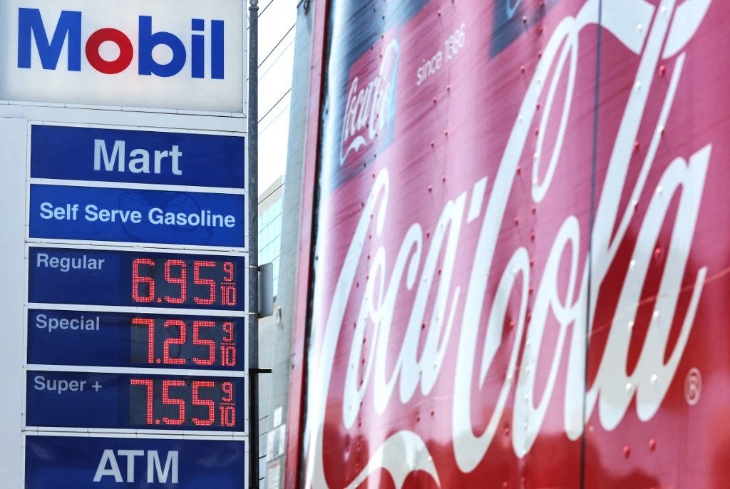 igh gas prices are displayed at a Mobil station across the street from the Beverly Center on March 7, 2022 in Los Angeles, California (AFP)