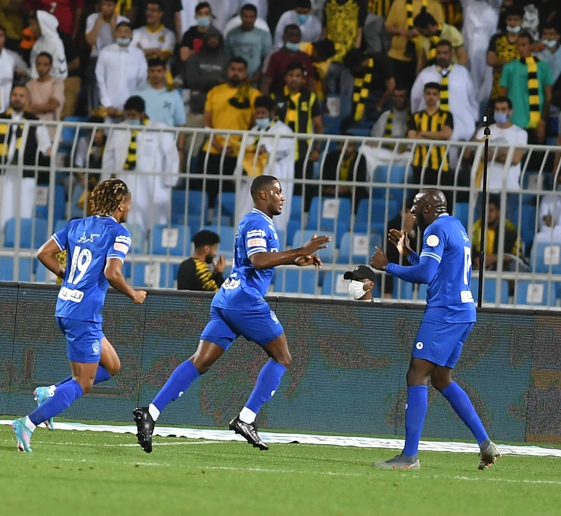 Odion Ighalo (center) celebrates scoring Al-Hilal's winner against SPL leaders Al-Ittihad on Tuesday night. (Basheer Saleh)
