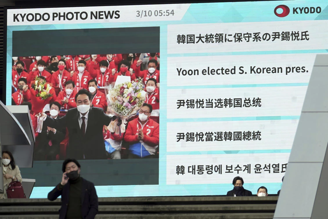 Above, a public TV screen in Tokyo shows South Korea’s president-elect Yoon Suk Yeol. (AP)