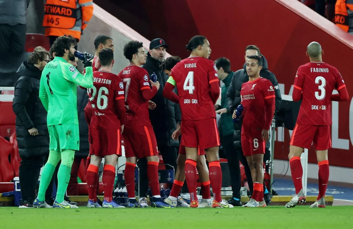 Liverpool manager Juergen Klopp with players as play is stopped due to a medical emergency in the stands during their Champions League match against Inter Milan at Anfield on Tuesday. (Reuters)