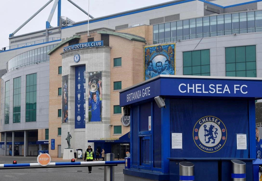 A security officer patrols at Stamford Bridge, the stadium for Chelsea Football Club, after Russian businessman Roman Abramovich said he would sell Chelsea, 19 years after buying it, in London. (Reuters)