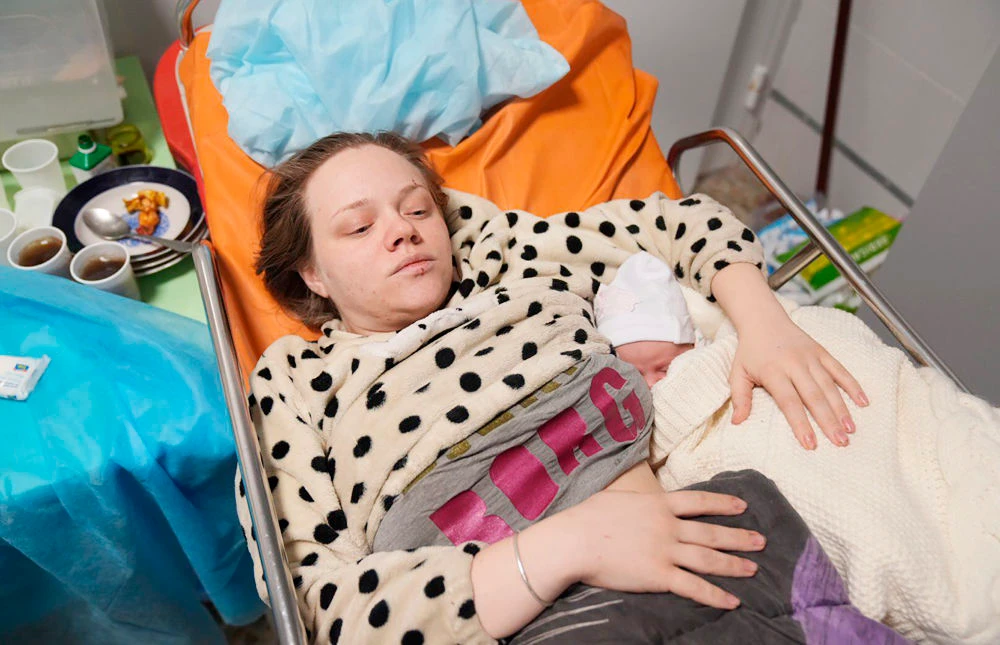 Mariana Vishegirskaya lies in a hospital bed after giving birth to her daughter Veronika, in Mariupol, Ukraine, Friday, March 11, 2022. (AP)