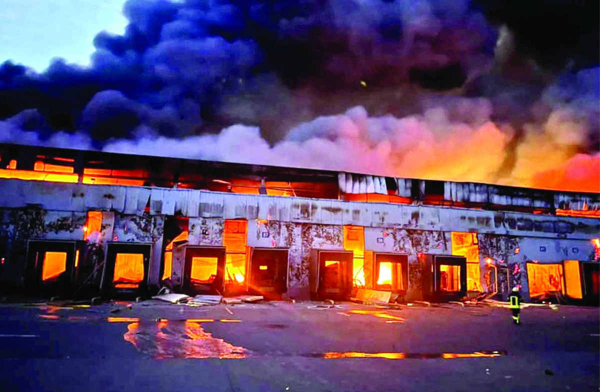 A warehouse storing frozen products is on fire following Russia’s shelling on the village of Kvitneve in Kyiv region, Ukraine, on March 12, 2022. (Reuters)