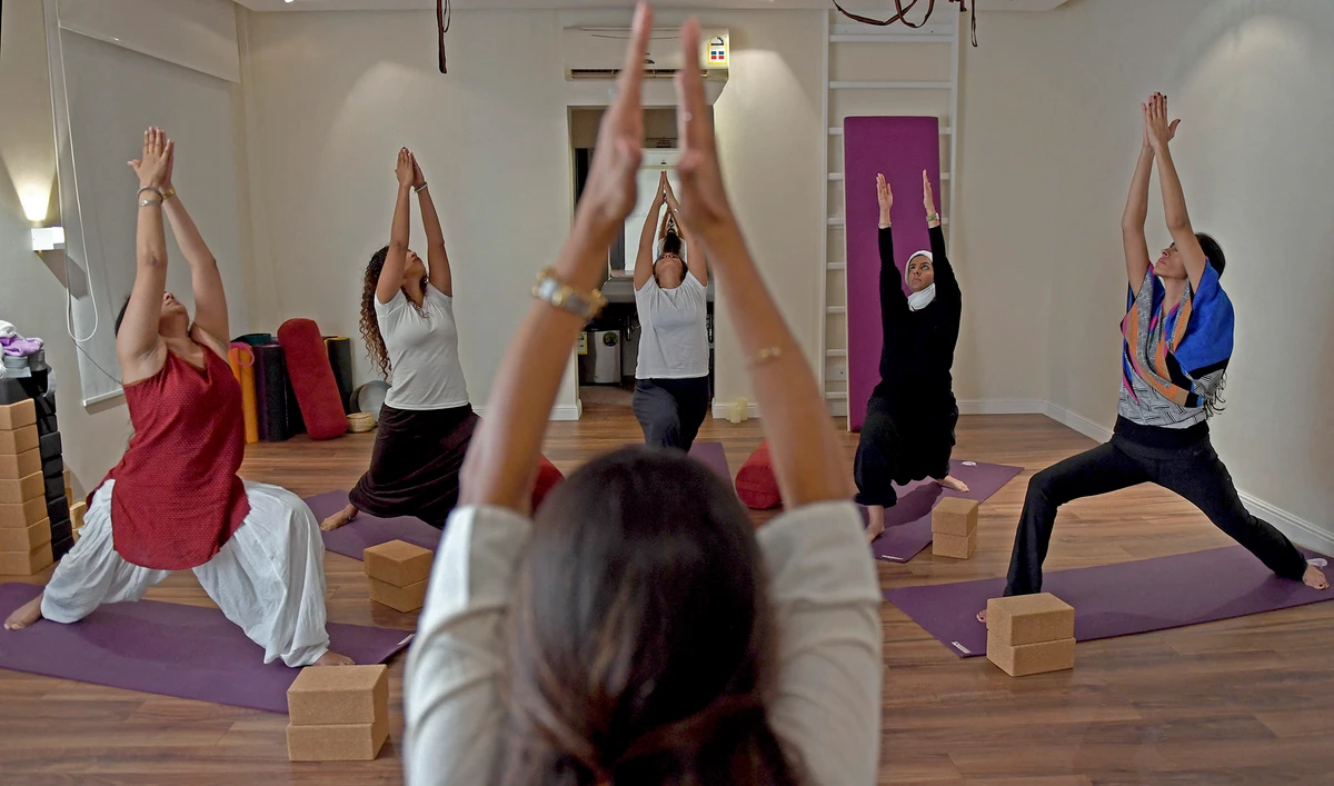 Nouf Marwaai, 38, the head of the Arab Yoga Foundation (foreground), instructs her yoga students with at her studio in Jeddah, Saudi Arabia, on September 7, 2018. (AFP/File)