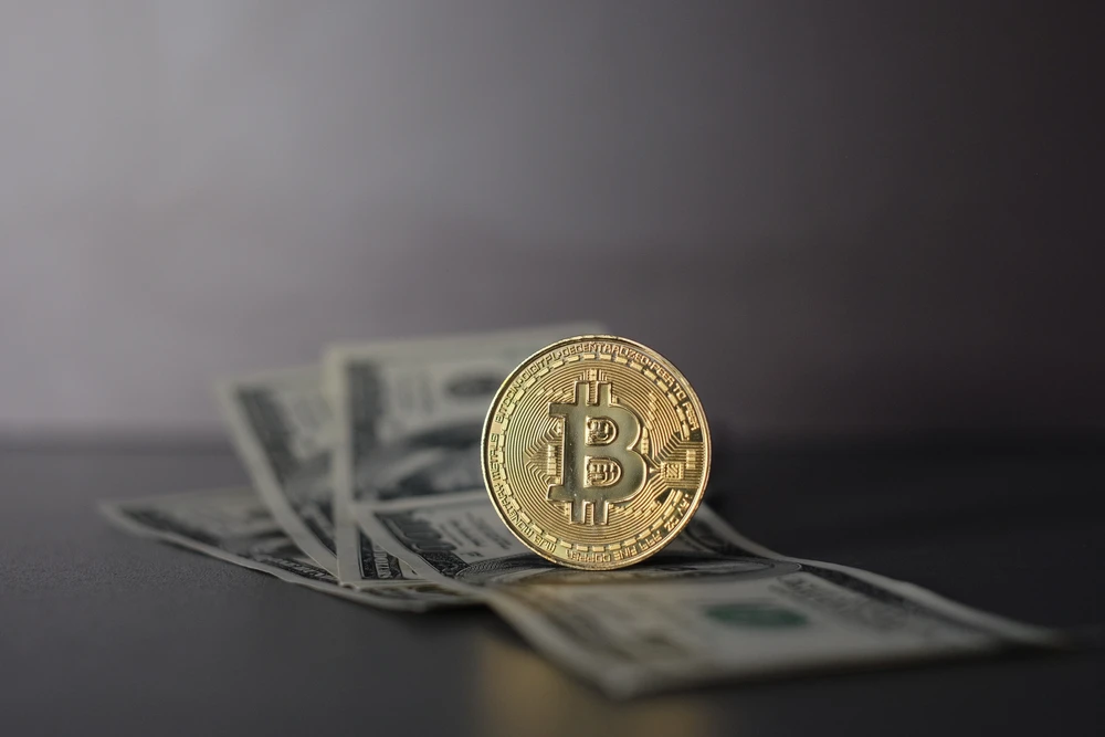 US Dollar and Digital money Bitcoin coin Put together. Shutterstock