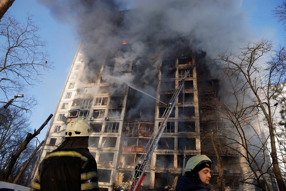 Firefighters work to put out a fire in a residential apartment building after it was hit by shelling in Kyiv, Ukraine, March 15, 2022. (Reuters)