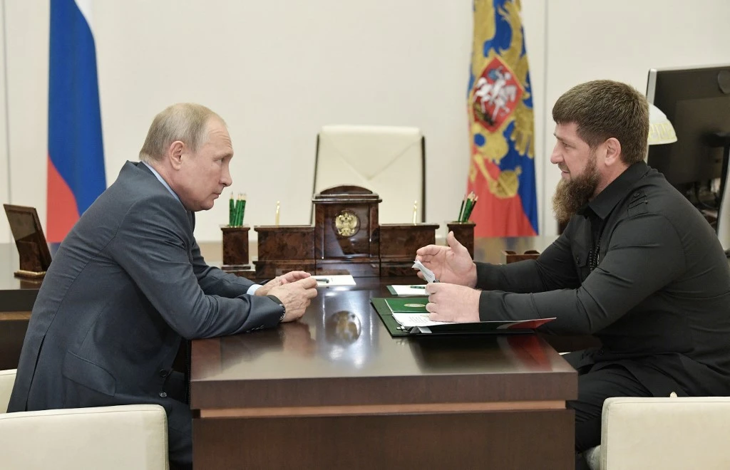 Head of the Chechen Republic Ramzan Kadyrov speaks with Russian President Vladimir Putin at the Novo-Ogaryovo state residence outside Moscow. (File/AFP)