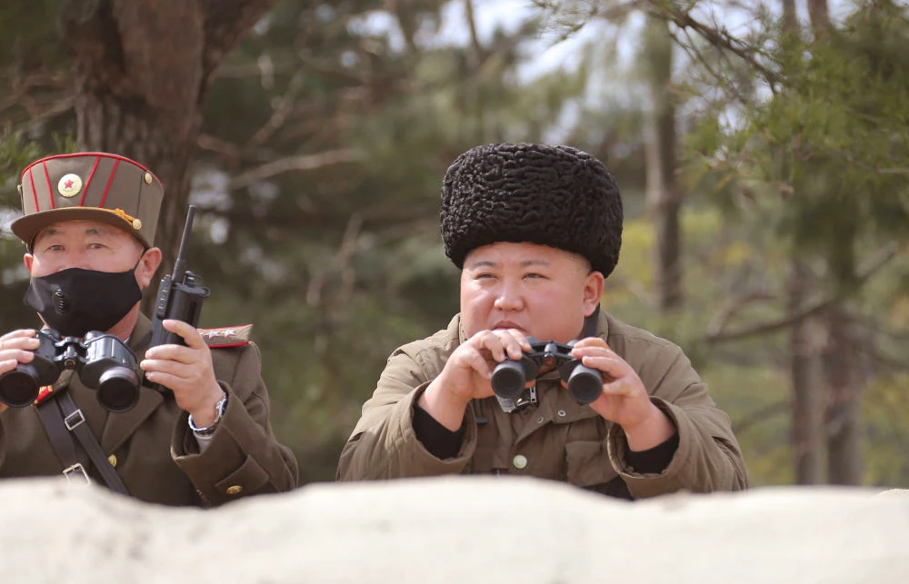 North Korean leader Kim Jong-Un (R) supervising a "strike drill" together with a high ranking officer in an undisclosed location in North Korea. (AFP file photo)
