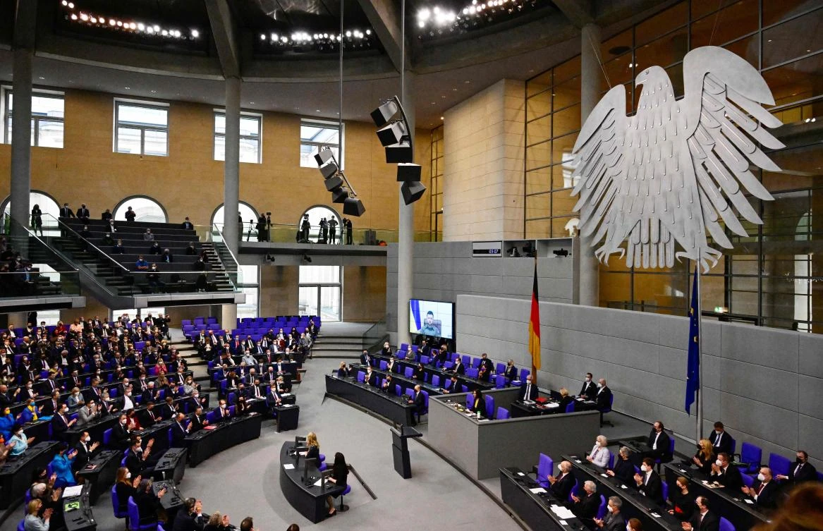Ukrainian President Volodymyr Zelensky’s speech before the German parliament was steeped in historical imagery from Germany’s triumph over its Cold War division. (AFP)