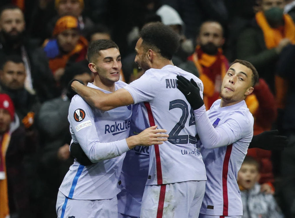 Barcelona’s Pedri celebrates scoring their first goal with Pierre-Emerick Aubameyang and Sergino Dest during their Europa League’s match against Galatasaray in Istanbul on Thursday. (Reuters)