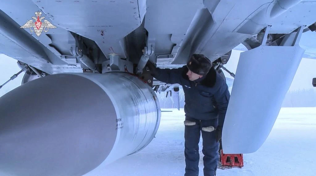 Above, an airman examines MiG-31K fighter of the Russian air force carrying a Kinzhal hypersonic cruise missile on Feb. 19, 2022. (Russian Defence Ministry/AFP)