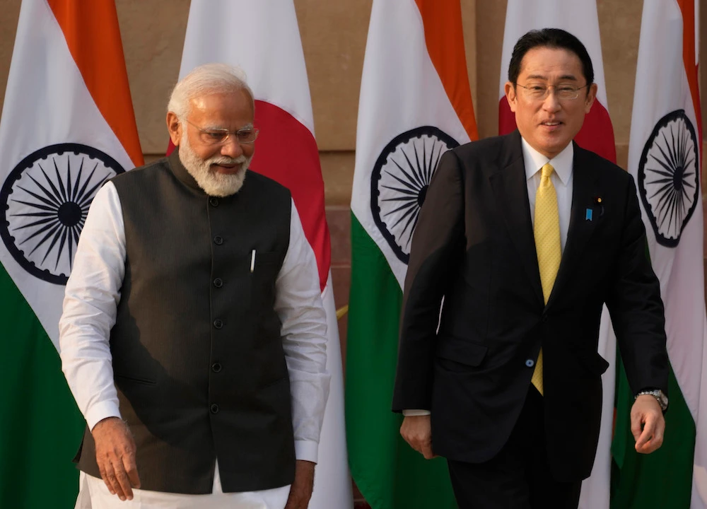 India’s prime minister Narendra Modi welcomes his Japanese counterpart Fumio Kishida upon his arrive in New Delhi on March 19, 2022. (AP)