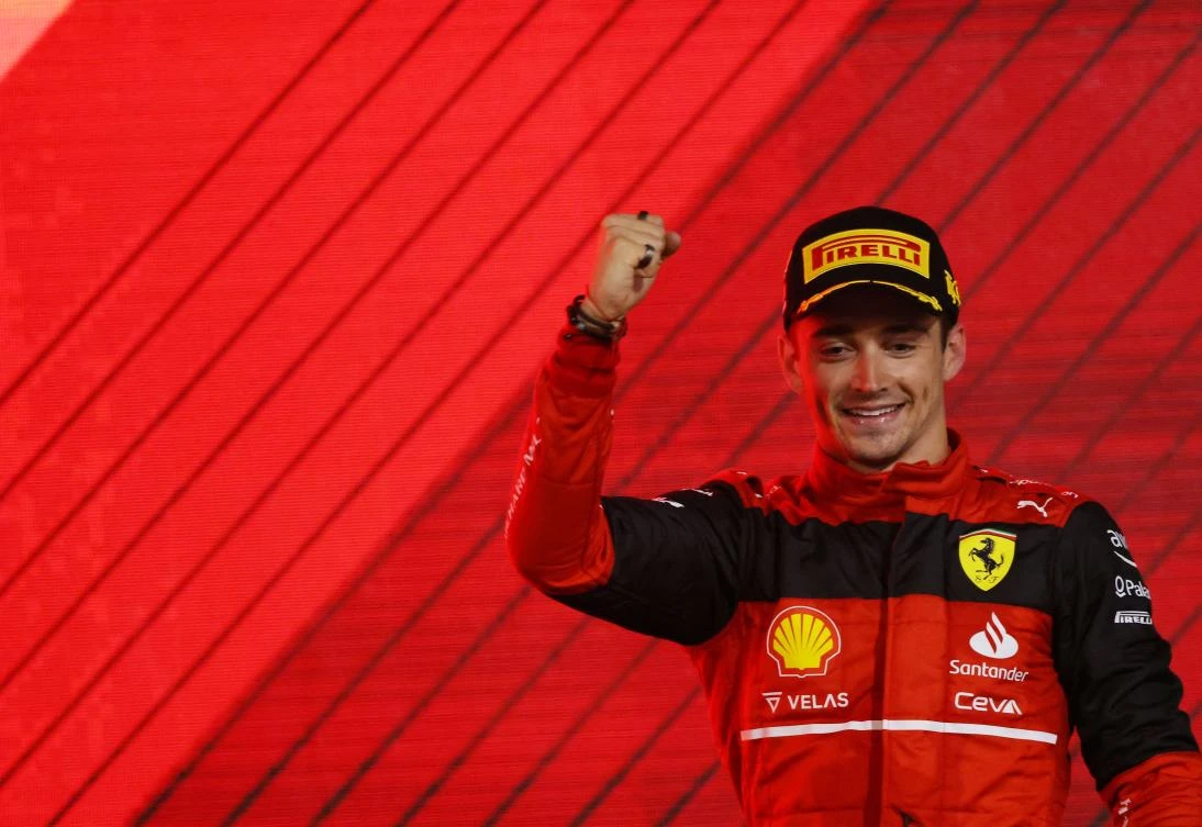 Ferrari’s Monegasque driver Charles Leclerc celebrates on the podium after winning the Bahrain Formula One Grand Prix at the Bahrain International Circuit, Sakhir, Bahrain, Mar. 20, 2022. (AFP)