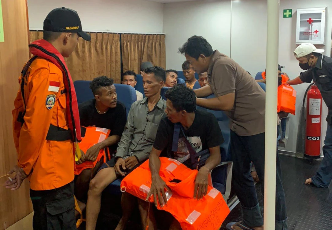 Rescuers identify survivors from a fishing boat that sank off the coast of Indonesia on March 19, 2022. (Search and Rescue via AFP)