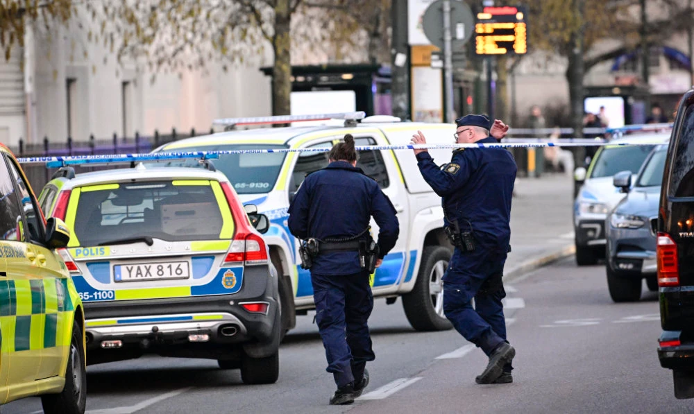 Police officers attend the scene at a school in Malmo, Sweden on Monday, March 21, 2022. (AP)