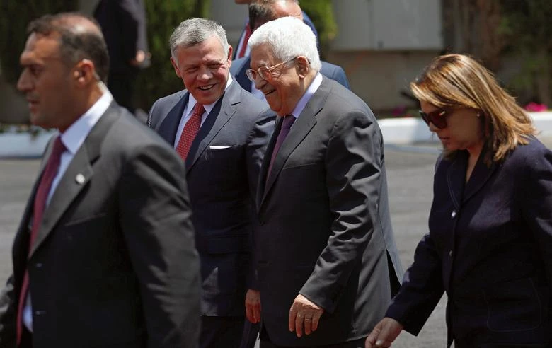 Jordan’s King Abdullah II walks with Palestinian President Mahmoud Abbas during a reception ceremony in the West Bank city of Ramallah, Aug. 7, 2017. (Reuters)