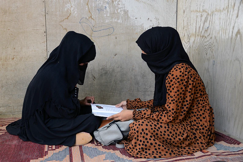 Afghan girls head back to school as Taliban end ban