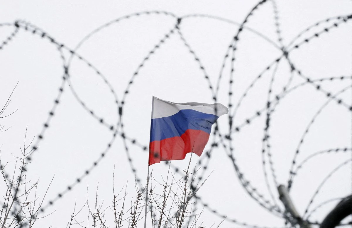 The Russian flag is seen through barbed wire in Kiev. (Reuters)