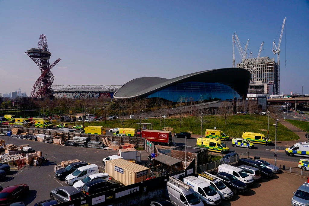 Emergency services near the Aquatics Centre, at the Queen Elizabeth Olympic Park, following a gas-related incident causing the area to be evacuated and cordoned off, in London on Wednesday. (AP)