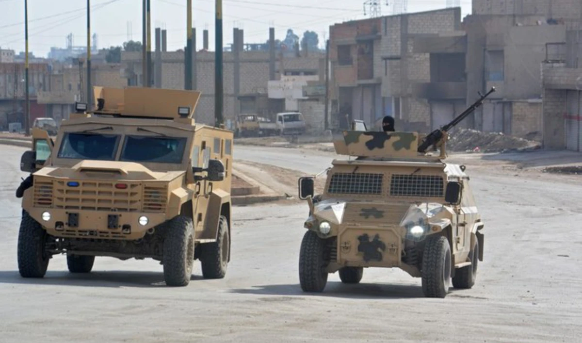 Syrian Democratic Forces (SDF) patrol a street in the northern Syrian city of Hasakeh on January 23, 2022. (AFP/File)