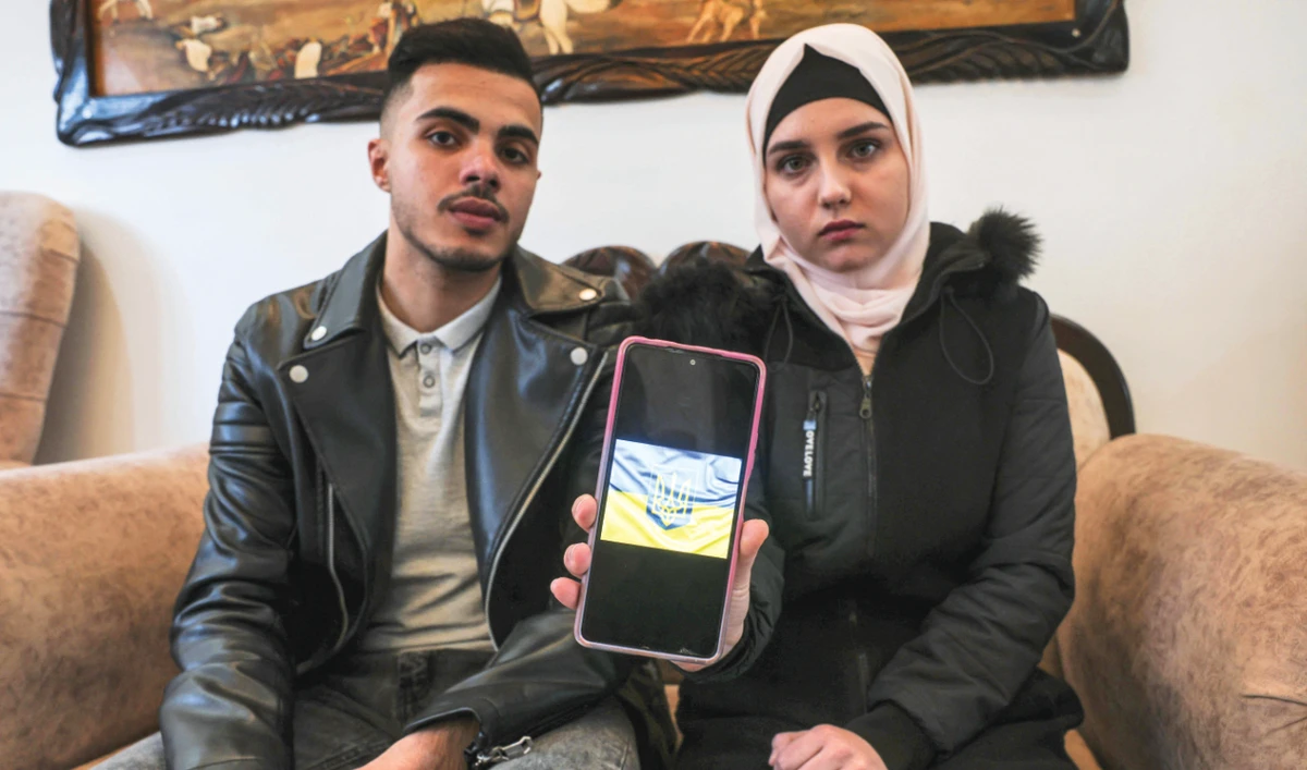 Ukrainian Viktoria Saidam with her Palestinian husband Ibrahim Saidam at their home in the Gaza Strip. (AFP)