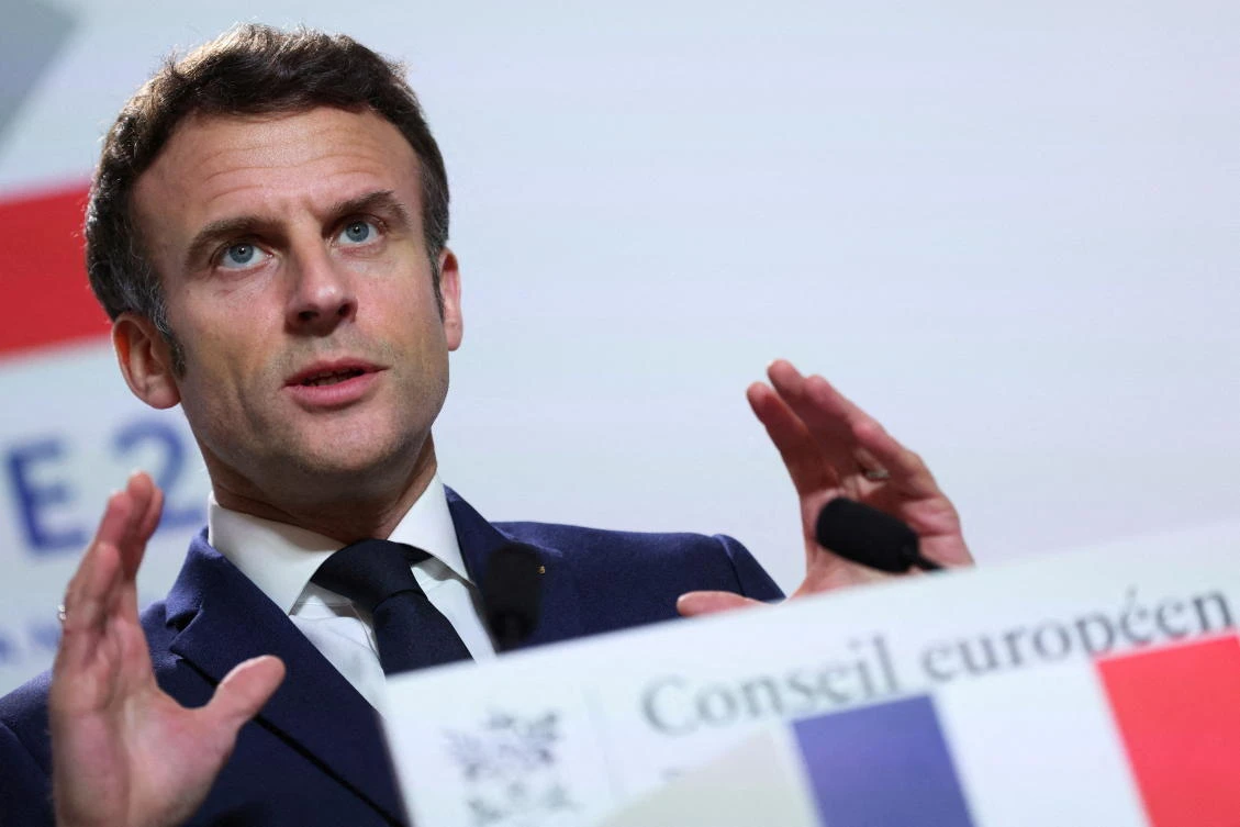 French President Emmanuel Macron gestures as he speaks to the media after European Union leaders’ summit, amid Russia’s invasion of Ukraine, in Brussels on Friday. (Reuters)