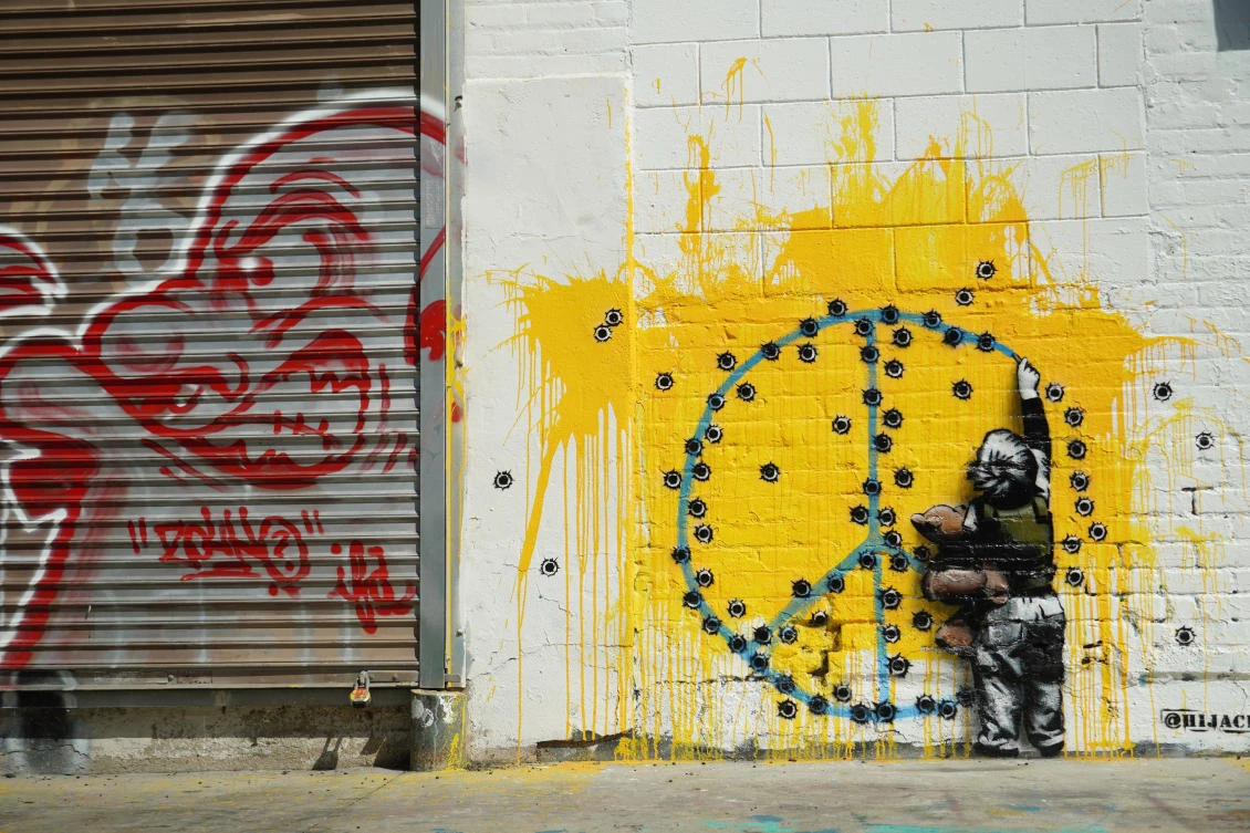 Street artist Hijack’s mural titled “War Child” is seen on a building wall in the Fairfax District of Los Angeles, on Monday. (AP)
