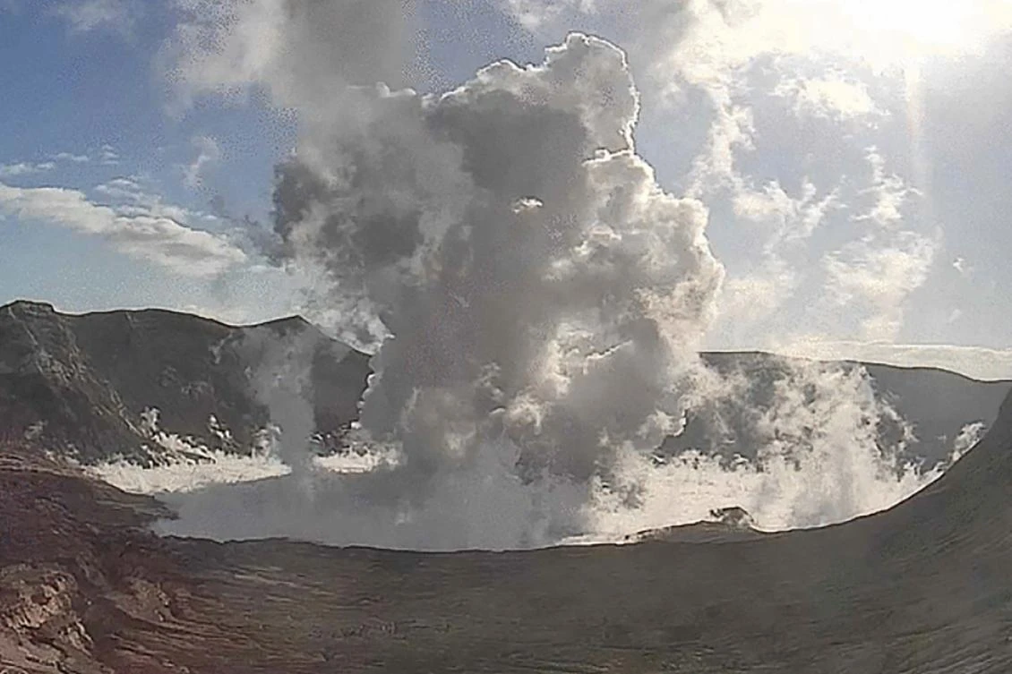 Taal volcano, which sits in a picturesque lake, sends ash and steam hundreds of meters into the sky after an eruption on March 26, 2022. (Philippine Volcanology and Seismology via AFP)