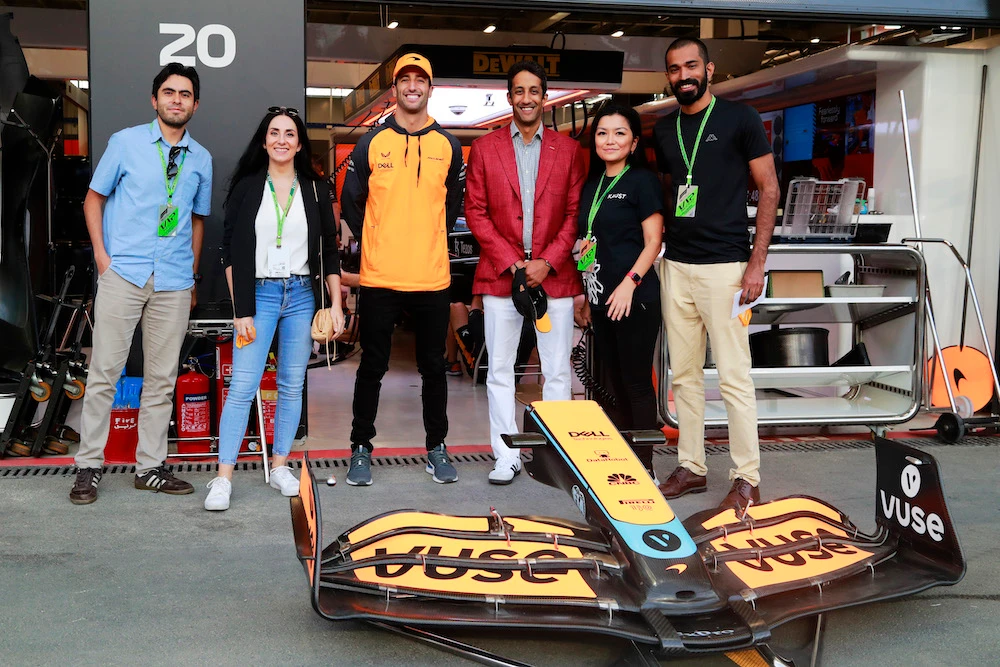Daniel Ricciardo meets with KAUST students outside the McLaren garage ahead of the Saudi Arabian Grand Prix. (LAT)