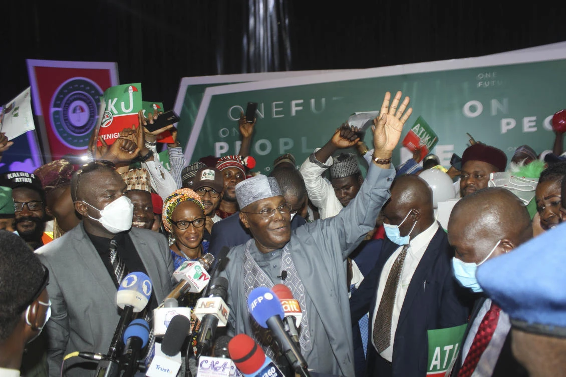 Nigeria's former Vice-President Atiku Abubakar, center, waves to the crowd after declaring he will run for next year presidential election in Abuja, Nigeria, Wednesday, March 23, 2022. (FILE/AP)