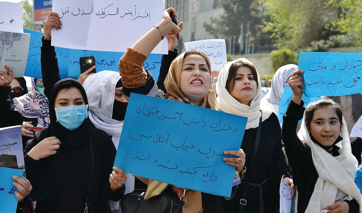 About two dozen schoolgirls and women staged a demonstration in the Afghan capital on Saturday demanding the Taliban leadership to reopen the schools. (AFP)