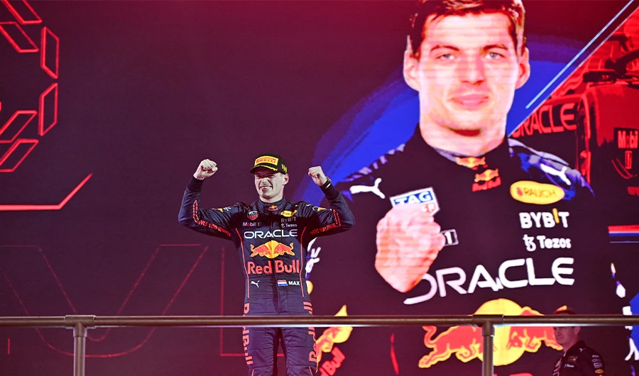 Red Bull's Dutch driver Max Verstappen celebrates on the podium after the 2022 Saudi Arabia Formula One Grand Prix at the Jeddah Corniche Circuit on March 27, 2022. (AFP)