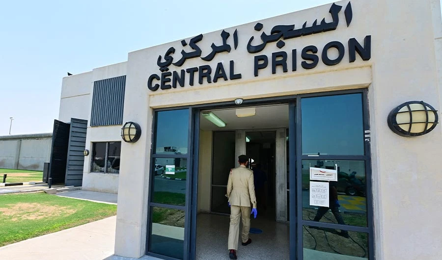 A policeman enters Dubai's Al-Awir central prison in the United Arab Emirates, on May 21, 2020. (AFP/FILE)