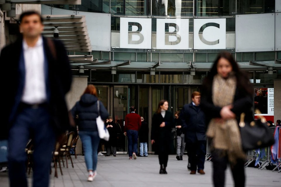 Pedestrians walk past a BBC logo at Broadcasting House in London, Britain, January 29, 2020. (REUTERS/FILE)