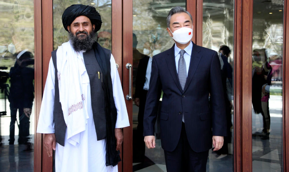Chinese Foreign Minister Wang Yi, right, stands next to Mullah Abdul Ghani Baradar, acting deputy prime minister of the Afghan Taliban's caretaker government, in Kabul, Afghanistan on March 24, 2022. (AP)