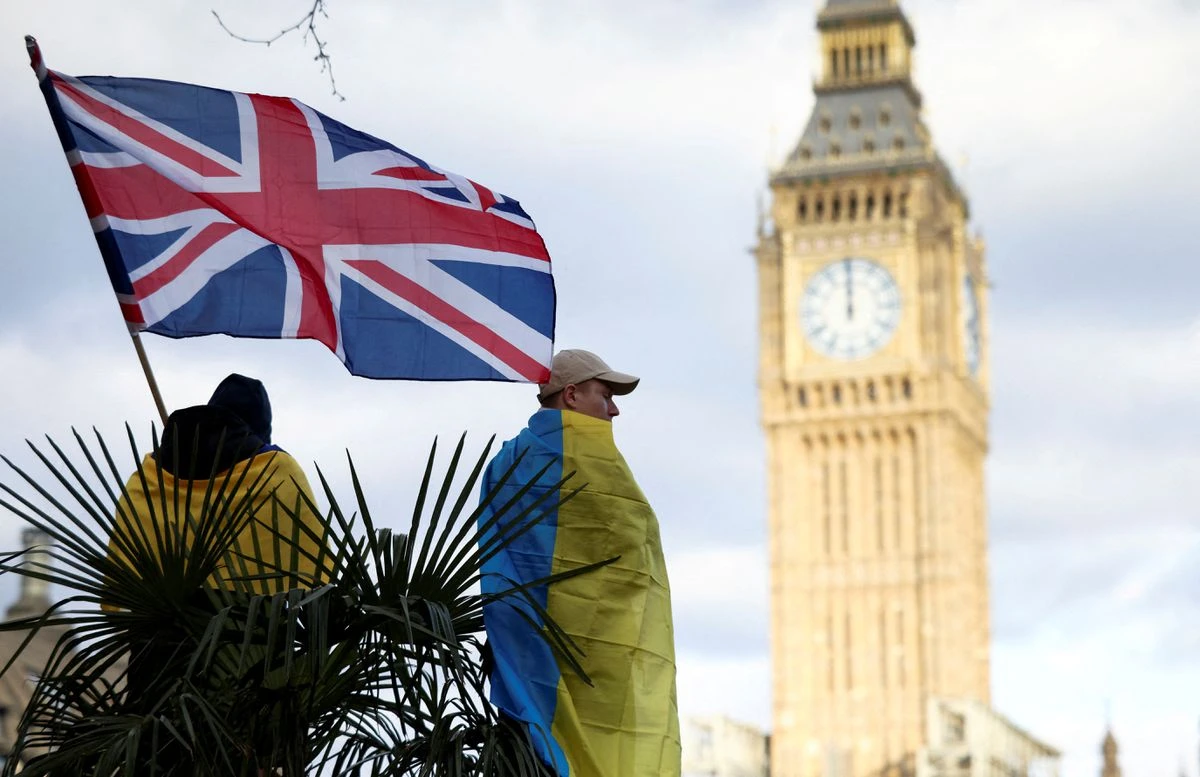A demonstrator holds a British flag during a protest against Russia's invasion of Ukraine, at Parliament Square in London, Britain, March 6, 2022. (Reuters)