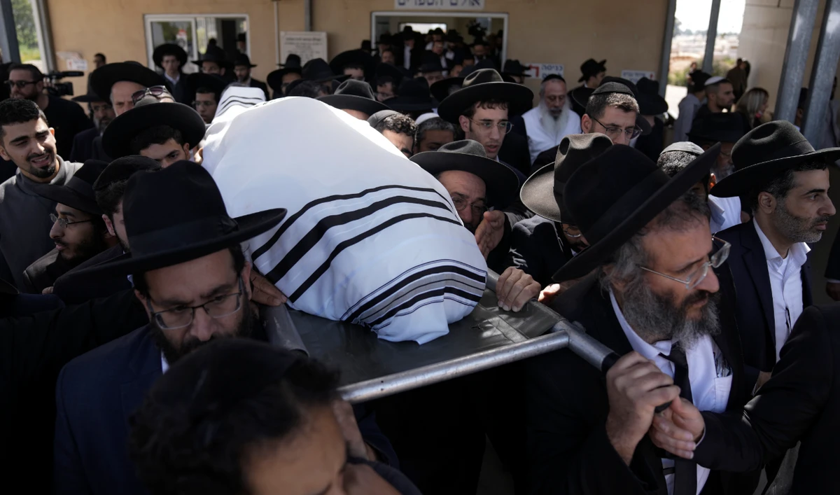 Mourners carry the body of Yaakov Shalom, 36, during his funeral in Petah Tikva, Israel, Wednesday, March 30, 2022. Shalom was one of five killed by a gunman in a crowded city in central Israel late Tuesday. (AP)