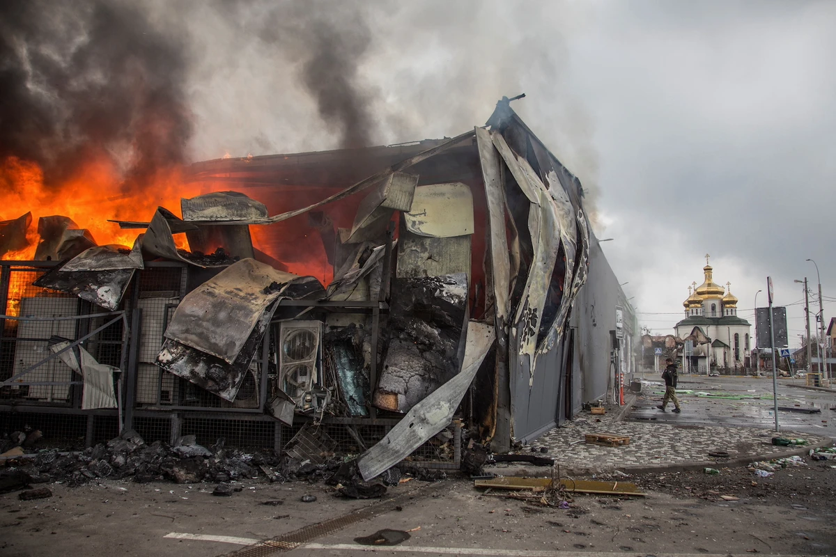Fire burns in a building after a shelling, as Russia's attack on Ukraine continues, in the town of Irpin, Kyiv region, Ukraine March 30, 2022. (Reuters)