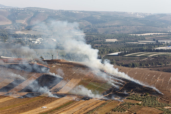 Smoke rises from shells fired from Israel in Maroun Al-Ras village, near the border with Israel, in southern Lebanon. (Reuters)