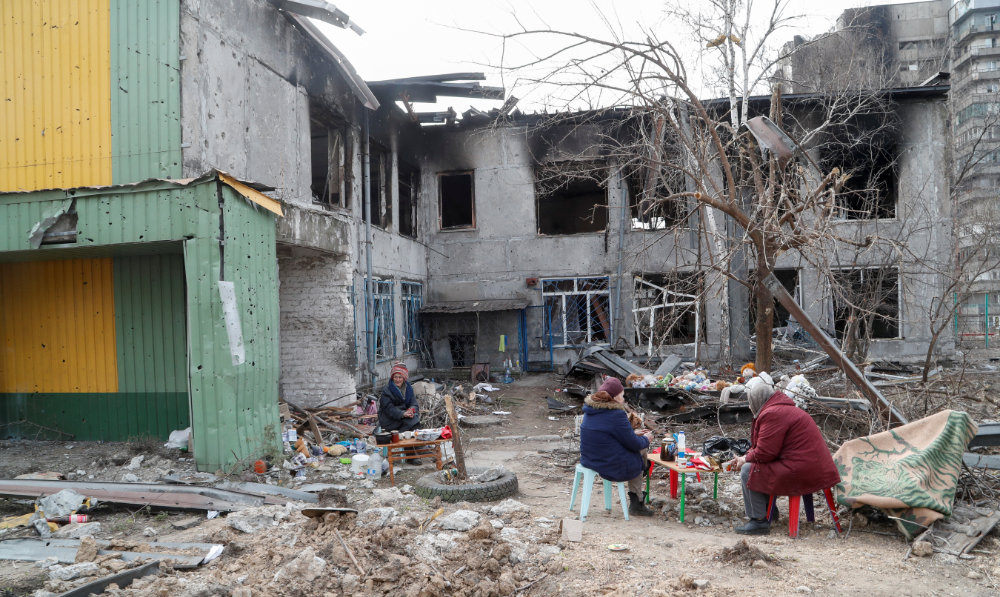 Local residents seek refuge in a children's home damaged in the course of Ukraine-Russia conflict in the southern port city of Mariupol, Ukraine April 1, 2022. (Reuters)
