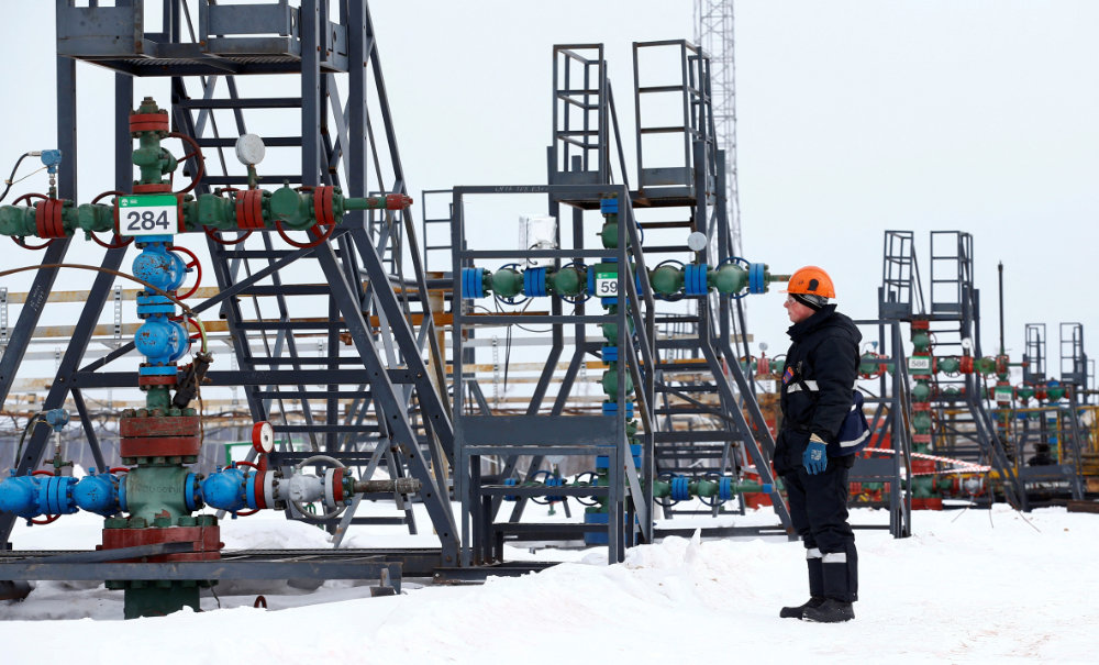 An employee inspects a well head in the Yarakta Oil Field, owned by Irkutsk Oil Company (INK), in Irkutsk Region, Russia. (Reuters/File)