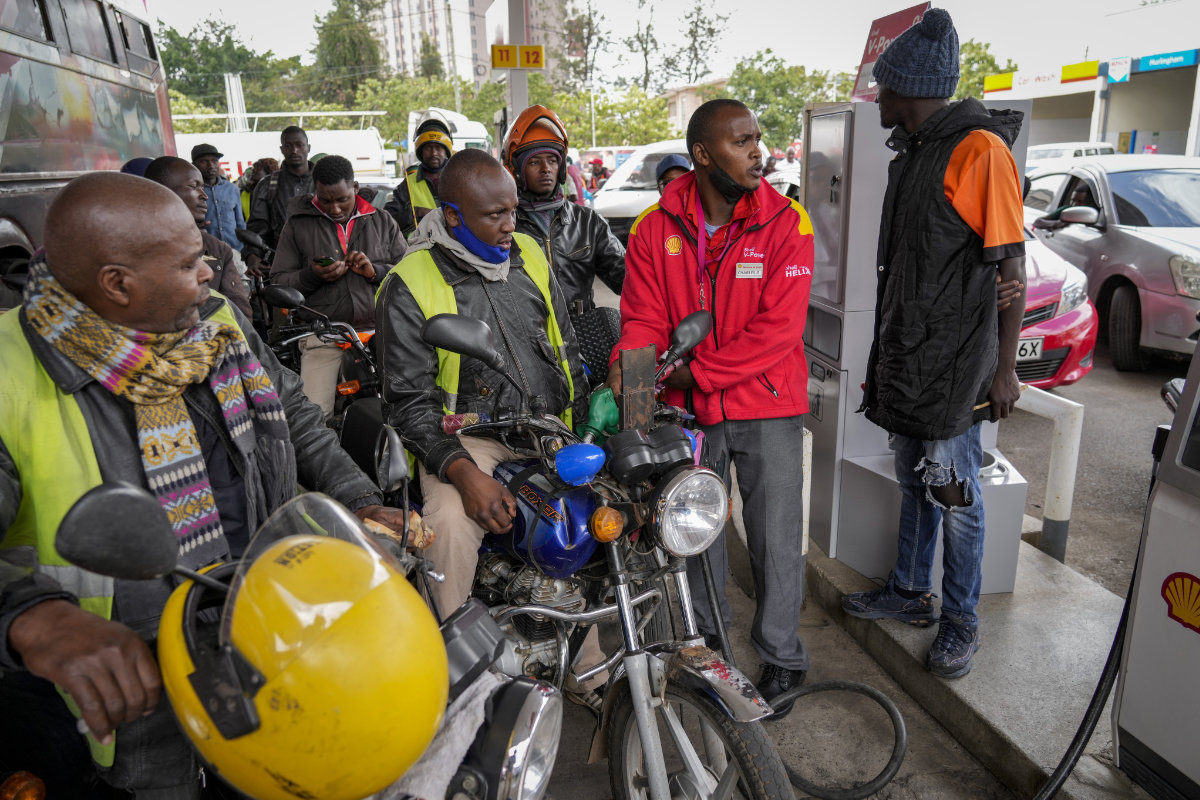 Motorcycle taxi drivers queue to buy gasoline at a filling station in Nairobi, Kenya, on April 14, 2022, amid a fuel shortage. (AP Photo/Khalil Senosi)