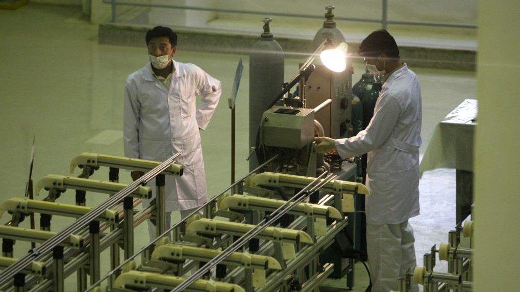 Iranian technicians working at a facility producing uranium fuel for a planned heavy water nuclear reactor, outside Isfahan, in 2009. (AP Photo)