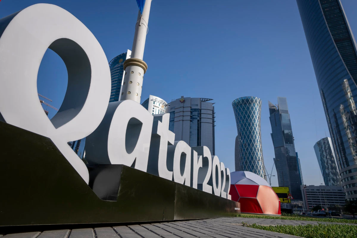 Branding is displayed near the Doha Exhibition and Convention Center in Doha, Qatar, where the soccer World Cup final draw will be held on April 1. (AP Photo/Darko Bandic)