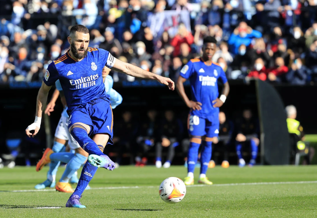 Real Madrid’s Karim Benzema scores his side’s opening goal during a Spanish La Liga match against Celta Vigo at the Balaidos stadium in Vigo, Spain, on Saturday. (AP)