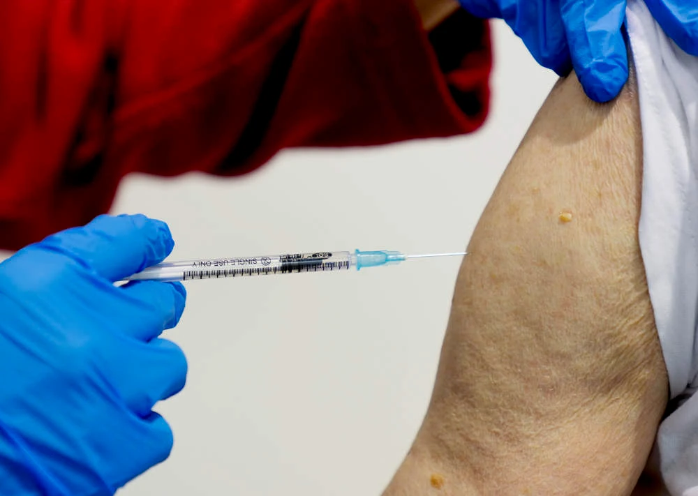 A 87-year-old man getting his booster shot at the vaccination center in Frankfurt, Germany, Thursday, Nov. 11, 2021. (AP)