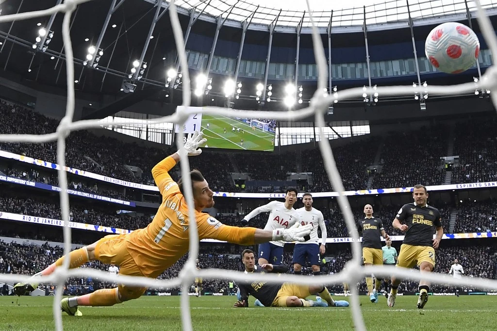 Tottenham Hotspur’s South Korean striker Son Heung-Min, center, buries one in back of the net against Newcastle United’s goalkeeper Martin Dubravka during their match in London, on April 3, 2022. (AFP)