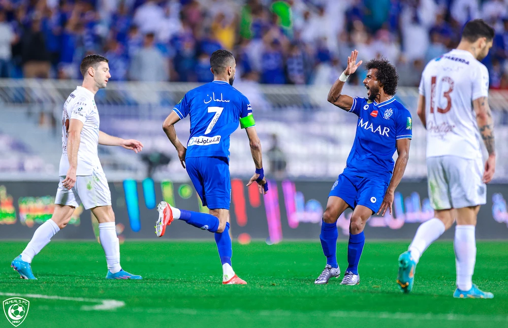 Al-Hilal captain Salman Al-Faraj, 7, and a team mate celebrate after hitting an equalizer during the 73rd minute. (Twitter: @Alhilal_EN)
